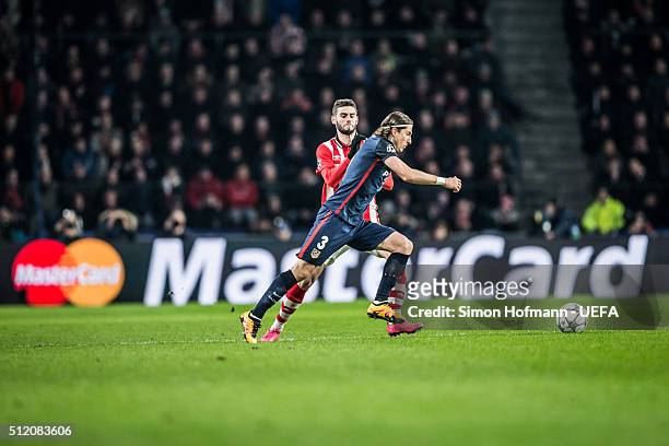 Filipe Luis of Madrid is challenged during the UEFA Champions League Round of 16 First Leg match between PSV Eindhoven and Club Atletico de Madrid at...