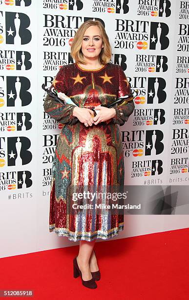 Adele poses in the winners room at the BRIT Awards 2016 at The O2 Arena on February 24, 2016 in London, England.