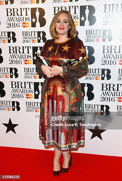Adele poses in the winners room at the BRIT Awards 2016 with her 4 Brit awards at The O2 Arena on February 24, 2016 in London, England.
