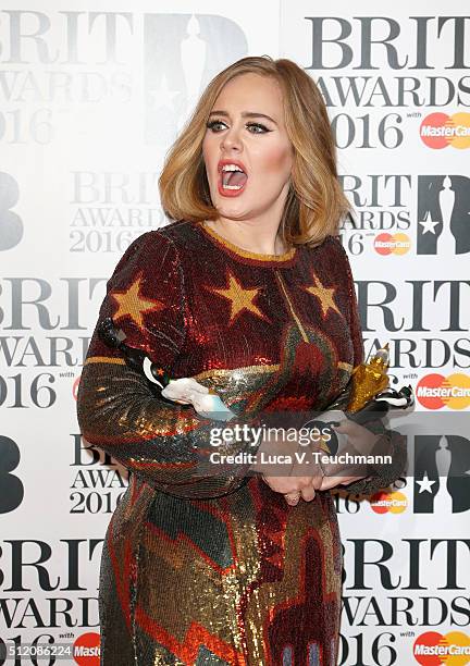 Adele poses in the winners room at the BRIT Awards 2016 with her 4 Brit awards at The O2 Arena on February 24, 2016 in London, England.