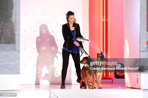Juliette Roux-Merveille and her Dogs attend the 'Vivement Dimanche' French TV Show at Pavillon Gabriel on February 24, 2016 in Paris, France.
