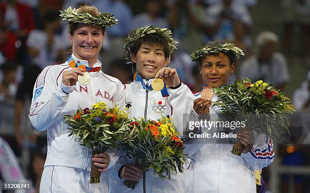 Tonya Verbeek of Canada silver medalist, Saori Yoshida of Japan, Gold medalist and Anna Gomis of France Bronze medalist stand on the podium after the...