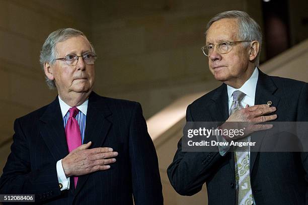 To R, Senate Majority Leader Mitch McConnell and Senate Minority Leader Harry Reid stand for the presentation of colors during a Congressional Gold...