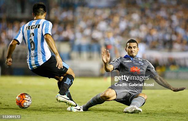 Luciano Lollo of Racing Club fights for the ball with Erwin Saavedra of Bolivar during a group stage match between Racing Club and Bolivar as part of...