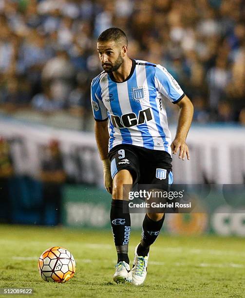 Lisandro Lopez of Racing Club drives the ball during a group stage match between Racing Club and Bolivar as part of Copa Bridgestone Libertadores...