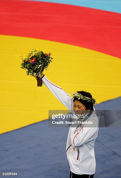 Kaori Icho of Japan receives her medal for the women's Freestyle wrestling 63 kg event on August 23, 2004 during the Athens 2004 Summer Olympic Games...