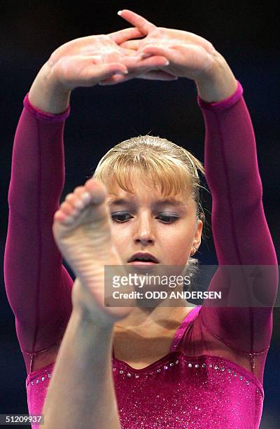 Russia's Anna Pavlova performs during the women's beam final, 23 August 2004 at the Olympic Indoor Hall in Athens during the Olympics Games. AFP...