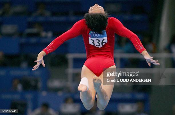 China's Nan Zhang performs during the women's beam final, 23 August 2004 at the Olympic Indoor Hall in Athens during the Olympics Games. AFP PHOTO /...