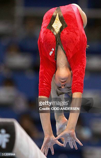 Romania's bronze medallist Alexandra Georgiana Eremia performs during the women's beam final, 23 August 2004 at the Olympic Indoor Hall in Athens...