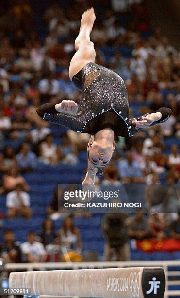 Romania's gold medallist Catalina Ponor performs during the women's beam final, 23 August 2004 at the Olympic Indoor Hall in Athens during the...