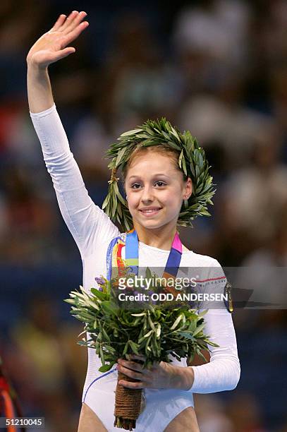 Romania's silver medallist Daniela Sofronie smiles on the podium of the women's floor exercice, 23 August 2004 at the Olympic Indoor Hall in Athens...