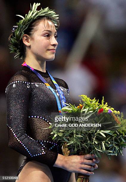 Romania's gold medallist Catalina Ponor smiles on the podium of the women's floor exercice, 23 August 2004 at the Olympic Indoor Hall in Athens...