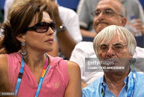 The boss of Formula one Bernie Ecclestone and his Croatian wife Slavica are seen in the stand during the men's vault final 23 August 2004 at the...
