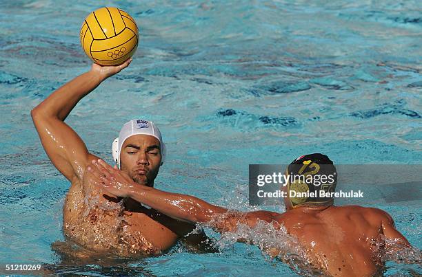 Gabriel Hernandez of Spain is challenged by Omar El Sammany of Egypt in the men's Water Polo preliminary game between Egypt and Spain on August 23,...