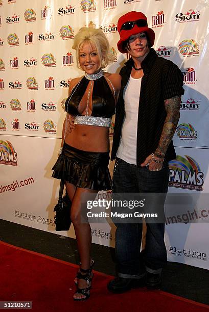 Tiffany and DJ Ashba arrive at the Palms? Girl Competition on August 20, 2004 at Club Xes in Hollywood, California.