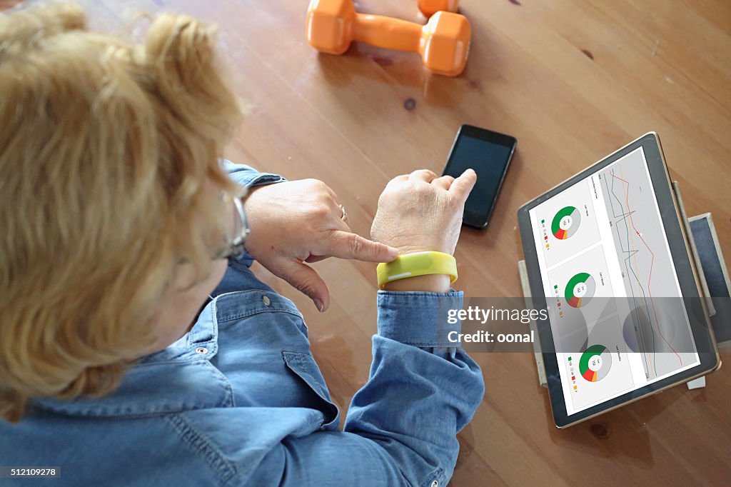 Senior woman using health technology