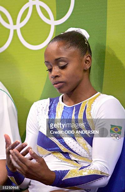 Brazil's Daiane Dos Santos reacts after the women's floor exercice final, 23 August 2004 at the Olympic Indoor Hall in Athens during the Olympics...