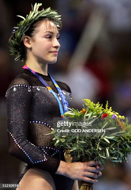 Romania's gold medallist Catalina Ponor smiles on the podium of the women's floor exercice, 23 August 2004 at the Olympic Indoor Hall in Athens...