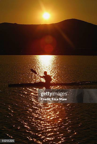 Kayaker warms up before the men's K-1 class 500 metre heat on August 24, 2004 during the Athens 2004 Summer Olympic Games at the Schinias Olympic...