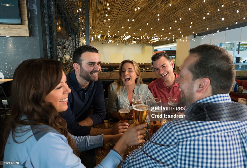 Group of friends drinking at the bar