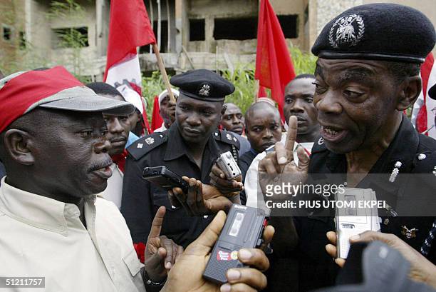 President of Nigeria's Labour Congress Adams Oshiomhole is warned by Police Commissioner Lawrence Alobi 24 August 2004 not to lead workers to a...