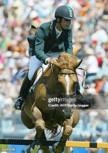 Brazilian jumping rider Rodrigo Pessoa clears the medal-fence on his horse "Baloubet Du Rouet" 24 August 2004 at the Markopoulo Olympic Equestrian...