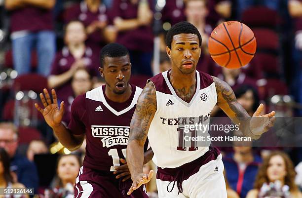 Anthony Collins of the Texas A&M Aggies battles for the basketball with I.J. Ready of the Mississippi State Bulldogs at Reed Arena on February 24,...