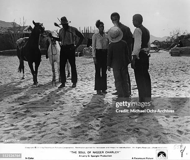 Actor Fred Williamson talks with a friends Denise Nicholas, D'Urville Martin and Kirk Calloway in a scene from the movie "The Soul Of Nigger Charley"...