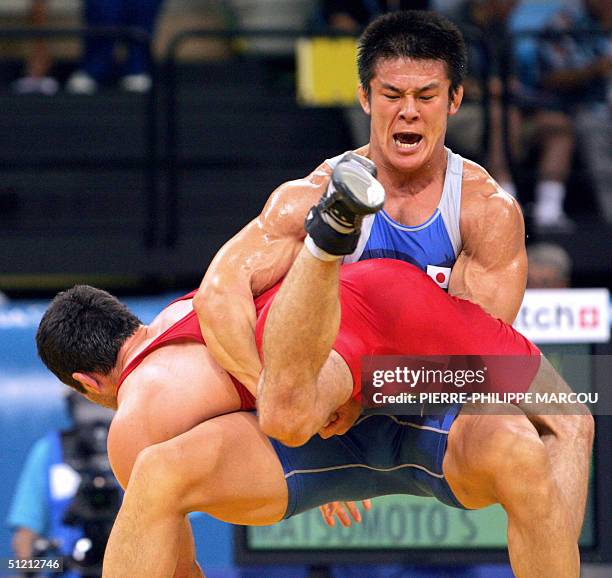 Japan's Shingo Matsumoto fights with Slovakia's Attila Batky in the men's Greco-Roman 84 kg elimination round at the Olympic Games in Athens, 24...