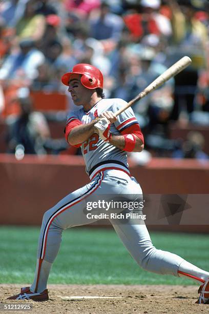 Jack Clark of the St. Louis Cardinals watches the flight of the ball as he follows through on a swing during a MLB season game circa August of 1985....