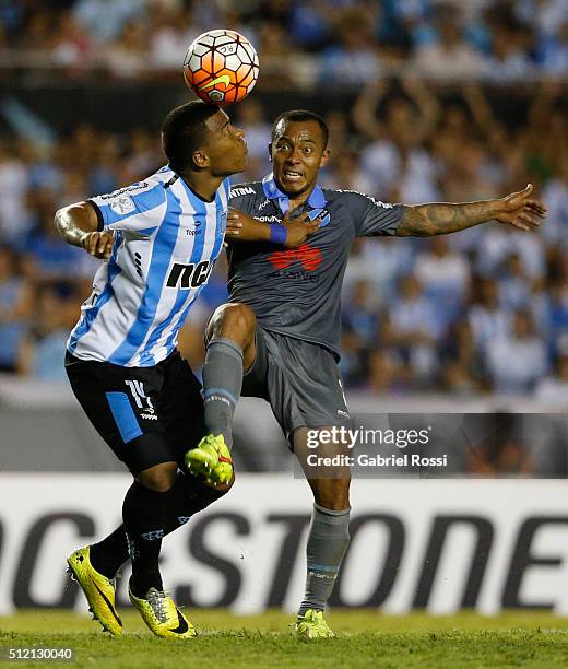 Roger Martinez of Racing Club fights for the ball with Edemir Rodriguez of Bolivar during a group stage match between Racing Club and Bolivar as part...