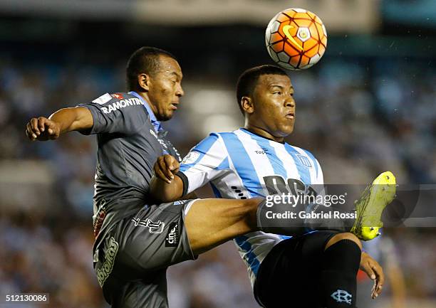 Roger Martinez of Racing Club fights for the ball with Edemir Rodriguez of Bolivar during a group stage match between Racing Club and Bolivar as part...