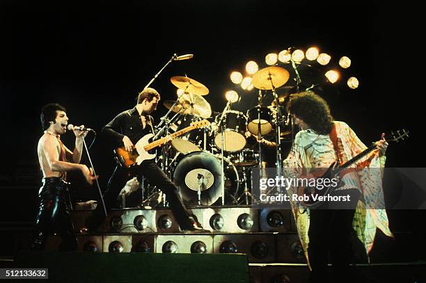 Queen perform on stage at Ahoy, Rotterdam, Netherlands, 29th January 1979. L-R Freddie Mercury, John Deacon, Brian May.