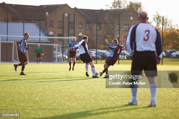 football players fighting for ball - amateur championship stockfoto's en -beelden