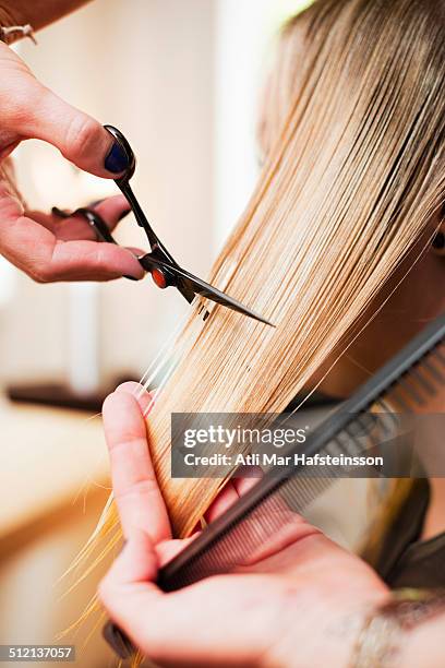 woman having haircut in salon - blonde straight hair stock pictures, royalty-free photos & images