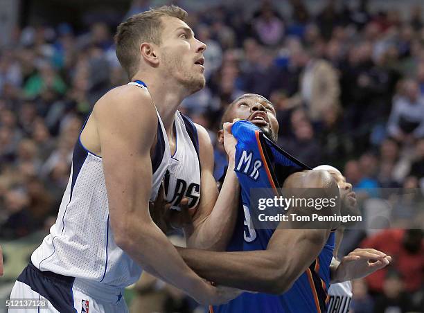 David Lee of the Dallas Mavericks gets tangled up with Serge Ibaka of the Oklahoma City Thunder in the first half at American Airlines Center on...