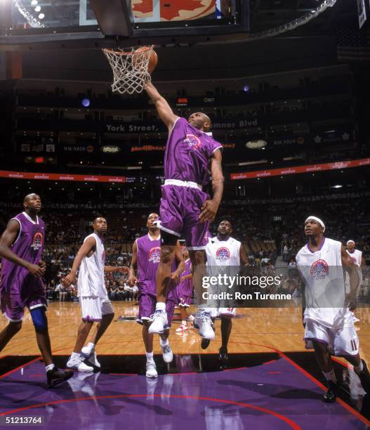 Jerry Stackhouse of the Dallas Mavericks makes a dunk during the Vince Carter All-Star Charity Game at Air Canada Centre on July 30, 2004 in Toronto,...