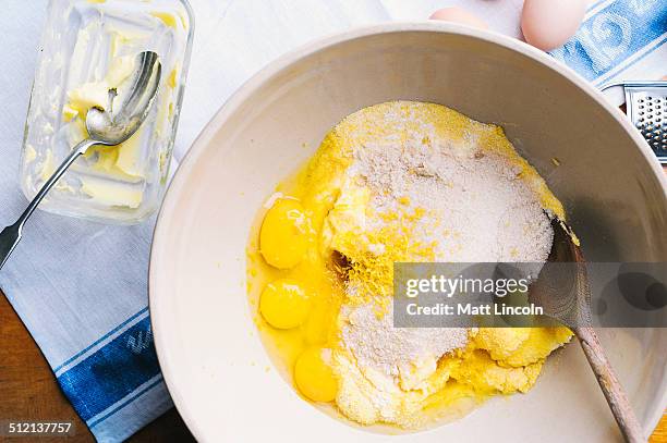 eggs and flour in mixing bowl - combining stock pictures, royalty-free photos & images