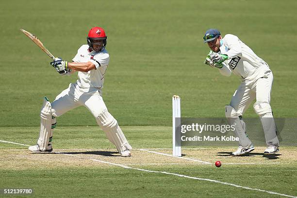 Jake Lehmann of the Redbacks bats as Ryan Carters of the Blues watches on during day one of the Sheffield Shield match between New South Wales and...