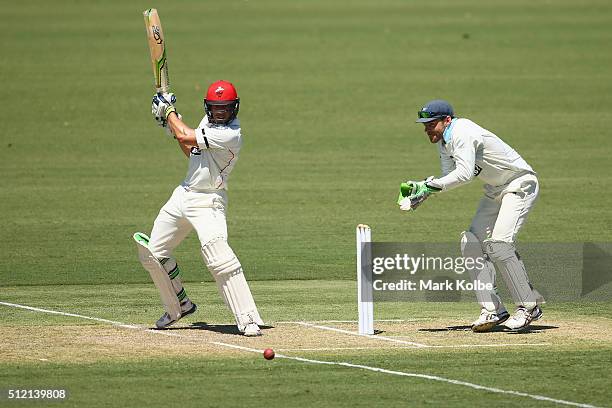 Jake Lehmann of the Redbacks bats as Ryan Carters of the Blues watches on during day one of the Sheffield Shield match between New South Wales and...