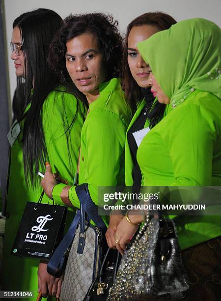 In this photo taken on February 24, 2016 shows transvestites who work as make-up artist lining up during beauty contest event in Banda Aceh, Aceh,...