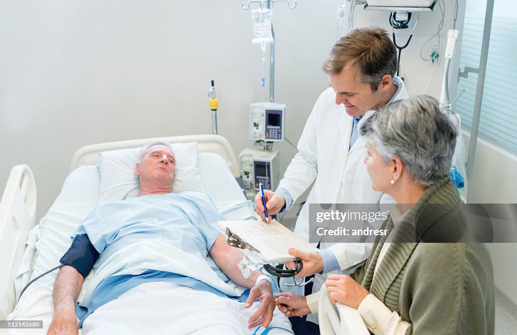 Doctor talking to patient's family at the hospital