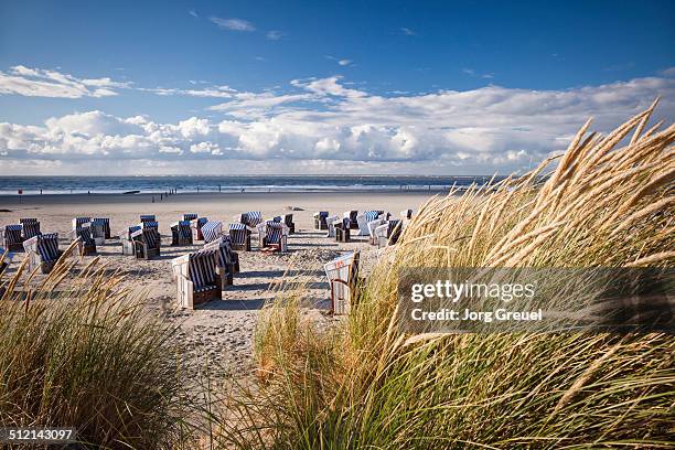 wicker beach chairs - norderney stock pictures, royalty-free photos & images