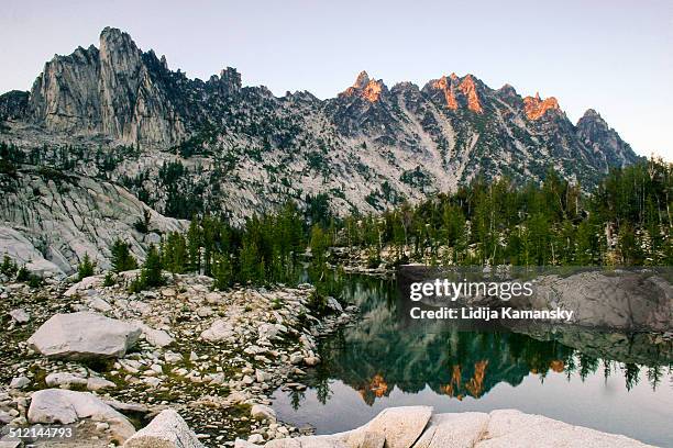 prusik peak and lake viviane reflection - leavenworth washington stock pictures, royalty-free photos & images