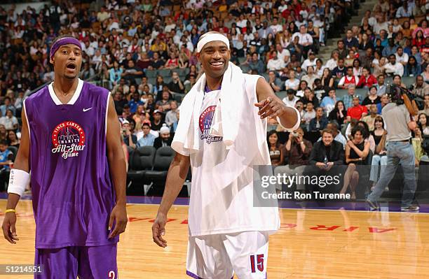 Vince Carter of the Toronto Raptors stands next to Morris Peterson of the Toronto Raptors during the Vince Carter All Star Charity Game at the Air...
