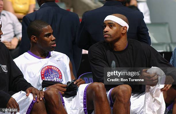 Vince Carter of the Toronto Raptors talks to Antawn Jamison of the Washington Wizards during the Vince Carter All Star Charity Game at the Air Canada...