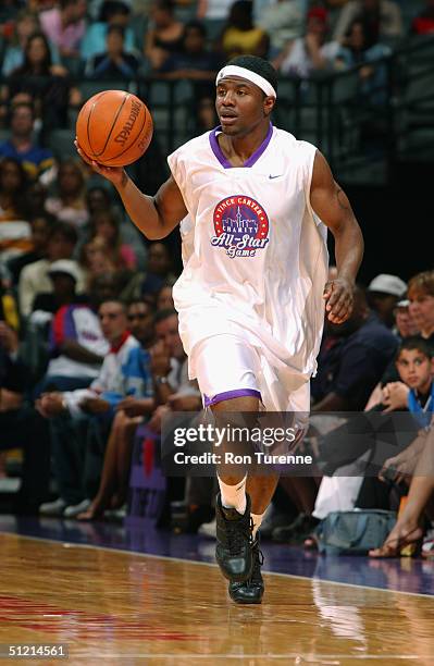 Shammond Williams of the New Orleans Hornets drives during the Vince Carter All-Star Charity Game at the Air Canada Centre on July 30, 2004 in...