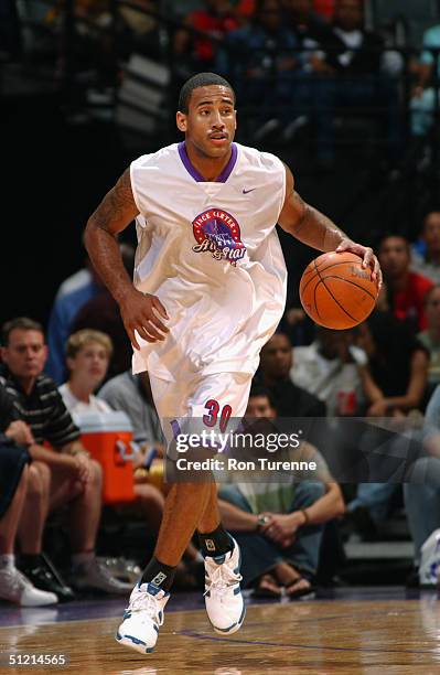 Dahntay Jones of the Memphis Grizzlies drives during the Vince Carter All-Star Charity Game at the Air Canada Centre on July 30, 2004 in Toronto,...