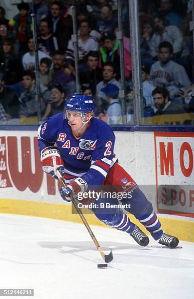 Brian Leetch of the New York Rangers skates with the puck during an NHL game against the against the New York Islanders on March 28, 1992 at the...