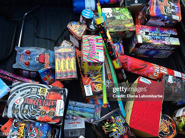 large assortment of fireworks piled together - firework box stock pictures, royalty-free photos & images
